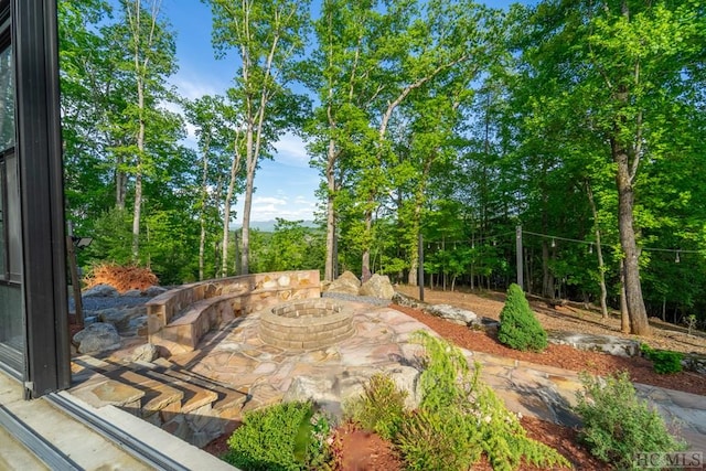 view of patio featuring an outdoor fire pit