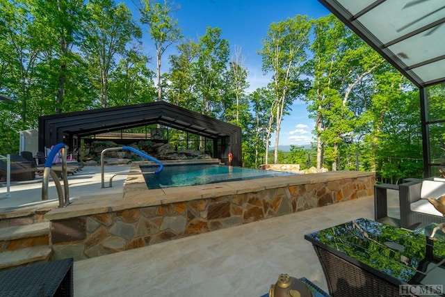 view of pool with a patio area and a gazebo