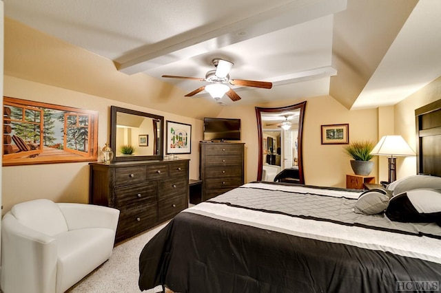 bedroom featuring light carpet, vaulted ceiling, and ceiling fan