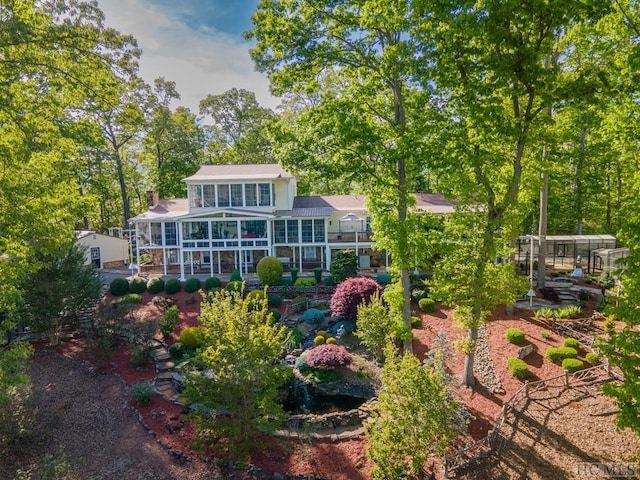 back of property featuring a sunroom