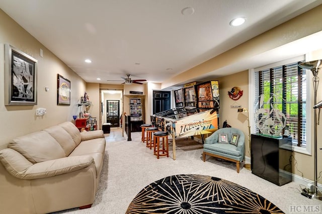 living room featuring carpet floors and ceiling fan