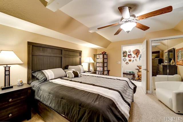 bedroom with ceiling fan, vaulted ceiling, light colored carpet, and a closet