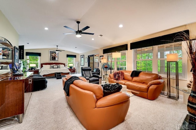 living room with ceiling fan and vaulted ceiling