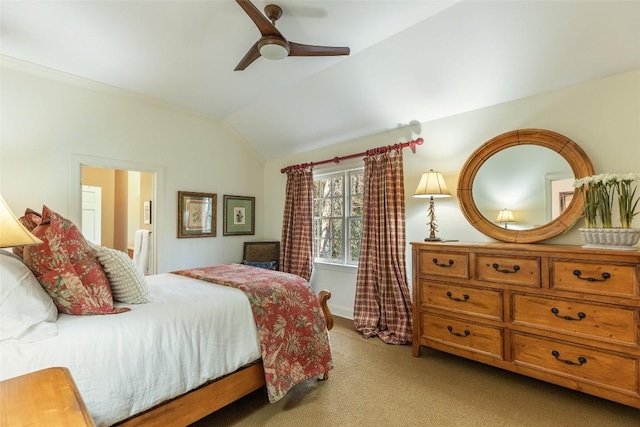 carpeted bedroom with vaulted ceiling and ensuite bathroom