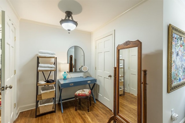 office featuring hardwood / wood-style flooring and crown molding