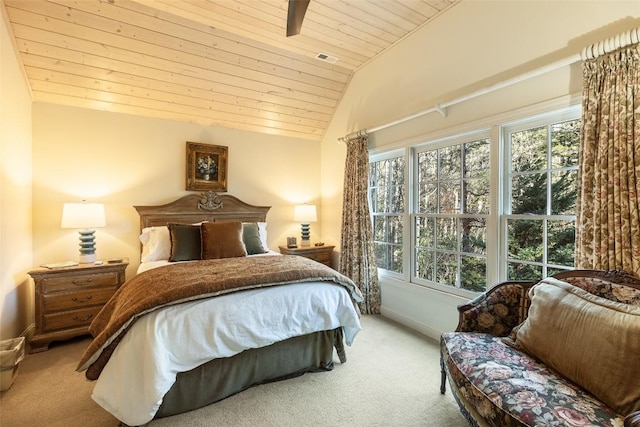 bedroom featuring multiple windows, vaulted ceiling, and light carpet