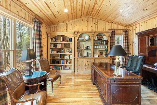 office featuring lofted ceiling, light hardwood / wood-style flooring, wood ceiling, and wood walls