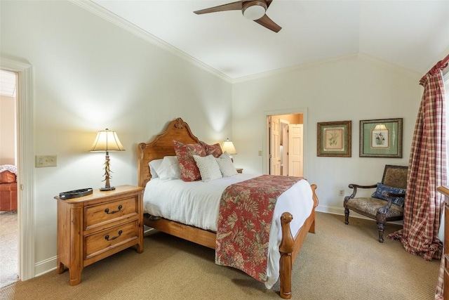 carpeted bedroom with vaulted ceiling, ceiling fan, and crown molding