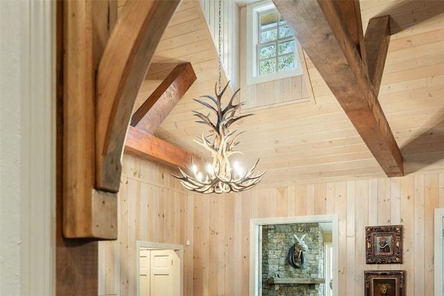 room details with a chandelier and wooden walls