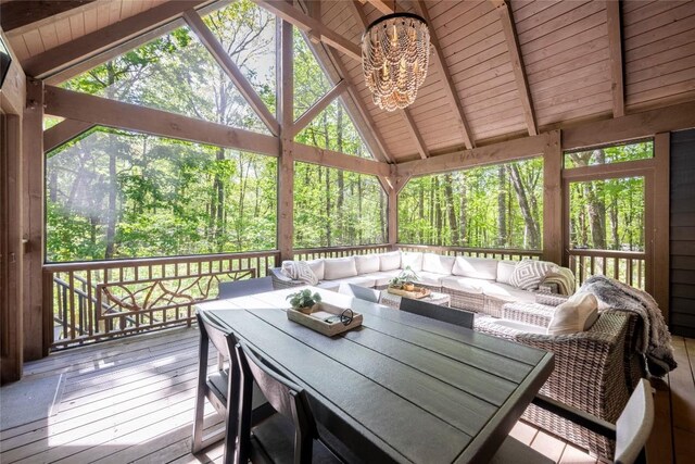 79 Azalea Ct, Sapphire, NC 28774 - sunroom with an outdoor living space, healthy amount of natural light, a chandelier, and a forest view