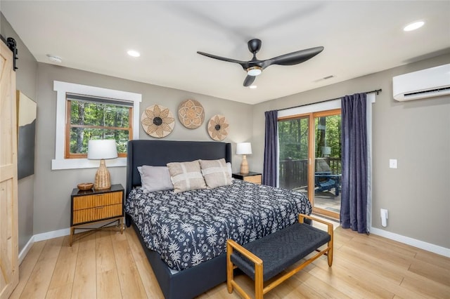 79 Azalea Ct, Sapphire, NC 28774 - bedroom featuring light wood-style floors, a wall mounted air conditioner, multiple windows, and recessed lighting