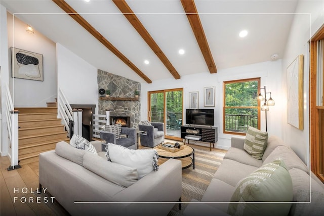 79 Azalea Ct, Sapphire, NC 28774 - living room featuring wood finished floors, a stone fireplace, beamed ceiling, recessed lighting, and stairway