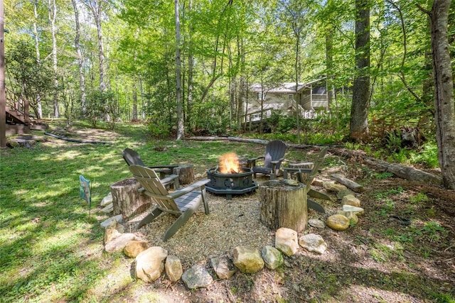 79 Azalea Ct, Sapphire, NC 28774 - view of grassy yard with an outdoor fire pit