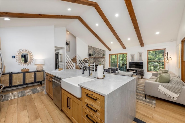 79 Azalea Ct, Sapphire, NC 28774 - kitchen featuring stainless steel dishwasher, a sink, beamed ceiling, light wood-type flooring, and open floor plan