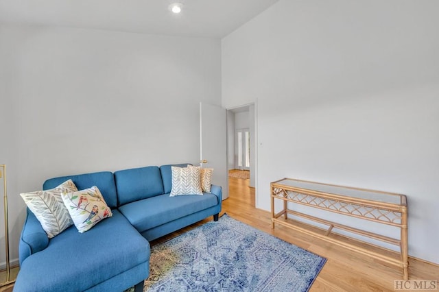 60 Lakeside Trl, Lake Toxaway, NC 28747 - living room featuring wood finished floors and high vaulted ceiling
