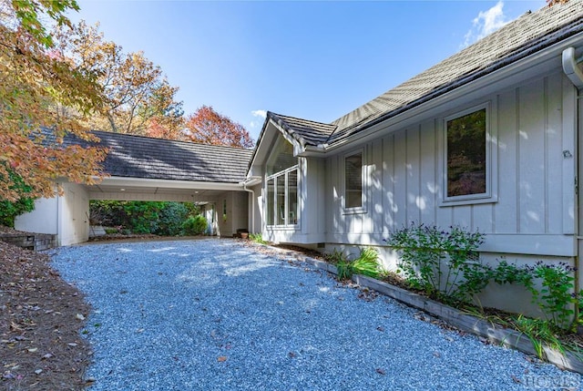 view of home's exterior with a carport