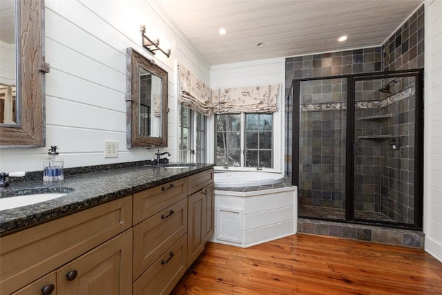 96 Mahalo Ln, Cullowhee, NC 28723 - full bath with double vanity, a stall shower, wood finished floors, a garden tub, and recessed lighting