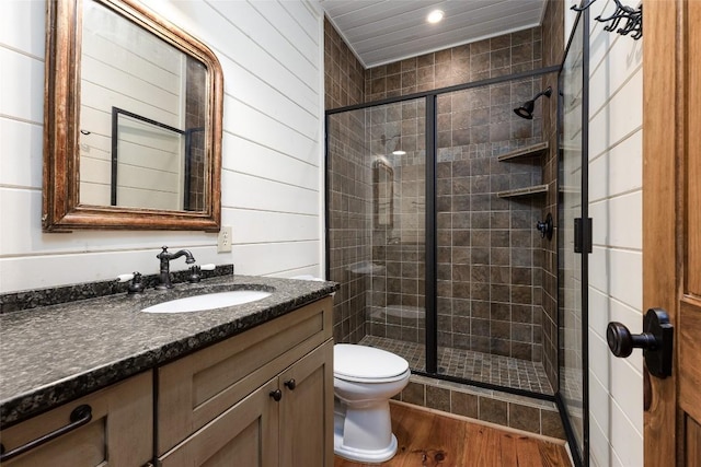 96 Mahalo Ln, Cullowhee, NC 28723 - bathroom featuring toilet, vanity, a shower stall, wood finished floors, and recessed lighting