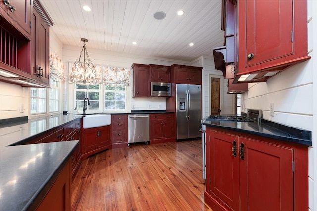 96 Mahalo Ln, Cullowhee, NC 28723 - kitchen featuring stainless steel appliances, dark countertops, a sink, light wood-style floors, and wooden ceiling