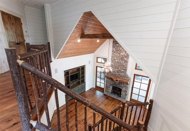 96 Mahalo Ln, Cullowhee, NC 28723 - stairs featuring a stone fireplace, wood-type flooring, and wooden ceiling
