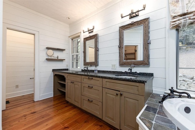 96 Mahalo Ln, Cullowhee, NC 28723 - bathroom with wood finished floors, double vanity, wood walls, a tub, and baseboards