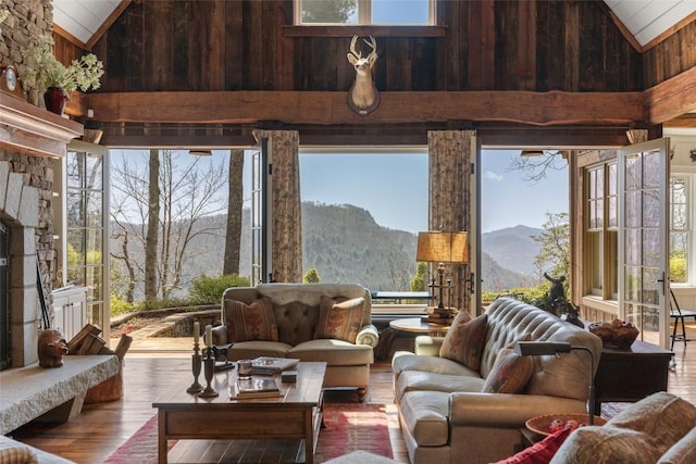 sunroom / solarium featuring a mountain view