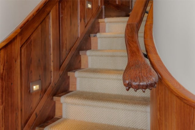 staircase with wooden walls