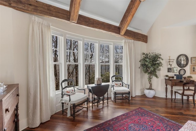 living area featuring vaulted ceiling with beams and wood finished floors