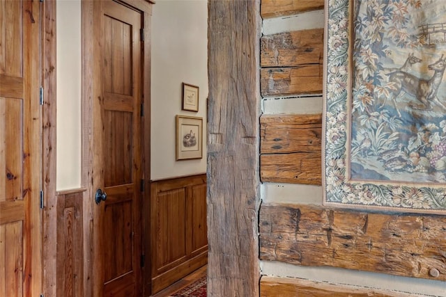 room details featuring wood walls and wainscoting
