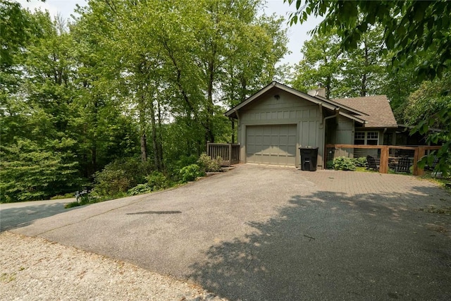 49 Jessamine Ln, Highlands, NC 28741 - view of front facade featuring an attached garage and driveway