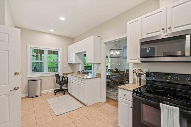 49 Jessamine Ln, Highlands, NC 28741 - kitchen featuring black range with electric stovetop, stainless steel microwave, white cabinetry, light tile patterned floors, and recessed lighting