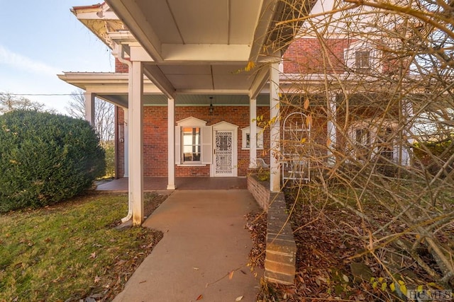 doorway to property featuring covered porch