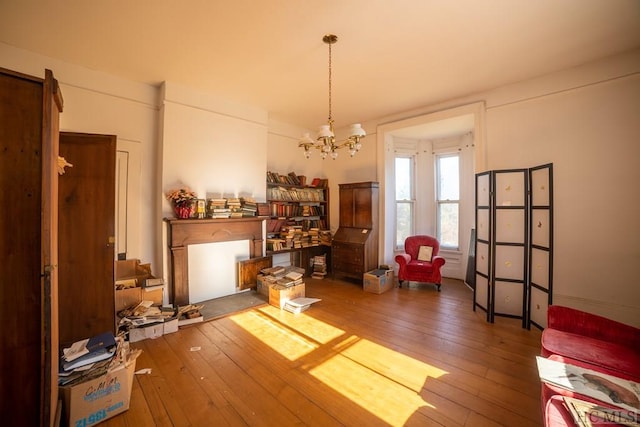 misc room with dark hardwood / wood-style flooring and an inviting chandelier