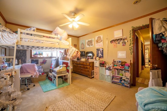 carpeted bedroom featuring crown molding and ceiling fan