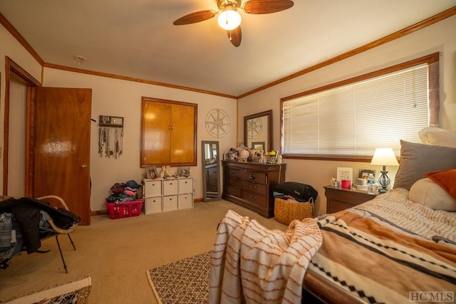 bedroom with ornamental molding, carpet, and ceiling fan