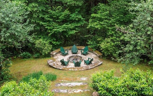 55 Oconee Belle Trl, Glenville, NC 28736 - view of green lawn featuring a fire pit and a patio