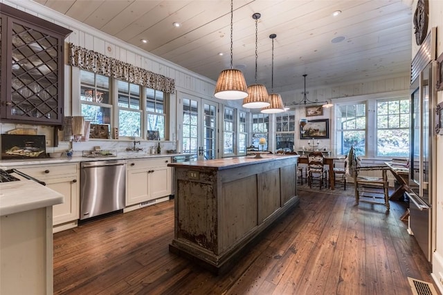 55 Oconee Belle Trl, Glenville, NC 28736 - kitchen featuring dark wood-style flooring, light countertops, wooden ceiling, stainless steel dishwasher, and pendant lighting