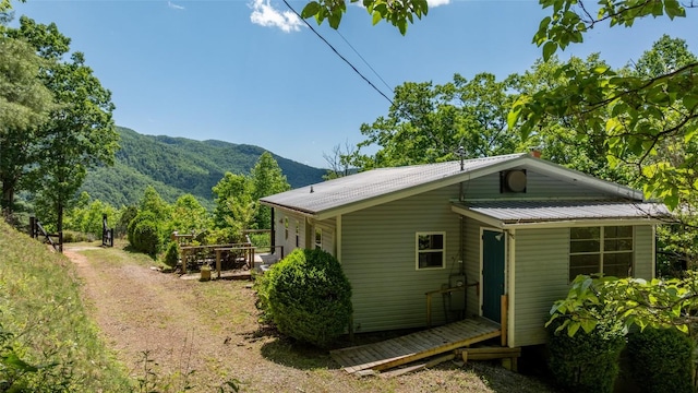 228 Mountain Laurel Dr, Franklin, NC 28734 - view of side of home featuring metal roof and a deck with mountain view