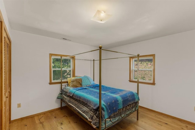 228 Mountain Laurel Dr, Franklin, NC 28734 - bedroom with baseboards and light wood-type flooring