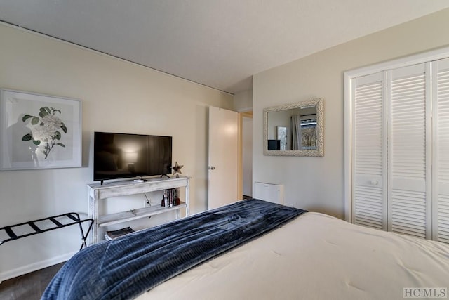 bedroom with wood-type flooring