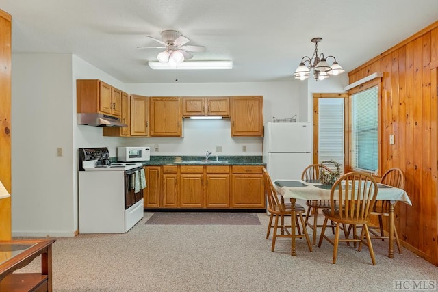 2177 Buck Creek Rd, Highlands, NC 28741 - kitchen with a sink, wooden walls, under cabinet range hood, white appliances, and dark countertops