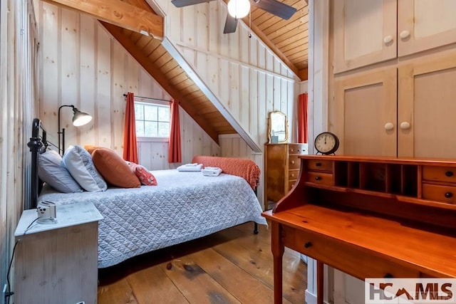 920 Sapphire Post Office Rd, Cashiers, NC 28774 - bedroom with wood-type flooring, lofted ceiling, wooden ceiling, and wood walls