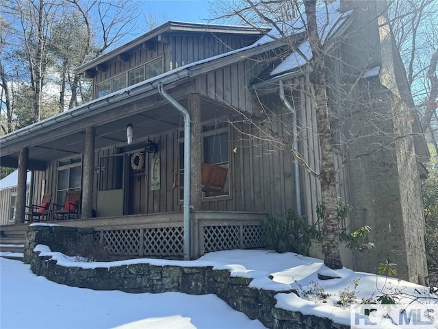 920 Sapphire Post Office Rd, Cashiers, NC 28774 - view of front of house with board and batten siding and a porch