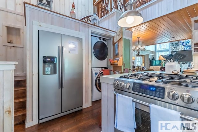 920 Sapphire Post Office Rd, Cashiers, NC 28774 - kitchen with appliances with stainless steel finishes, stacked washer / drying machine, a chandelier, dark wood-style flooring, and wood ceiling
