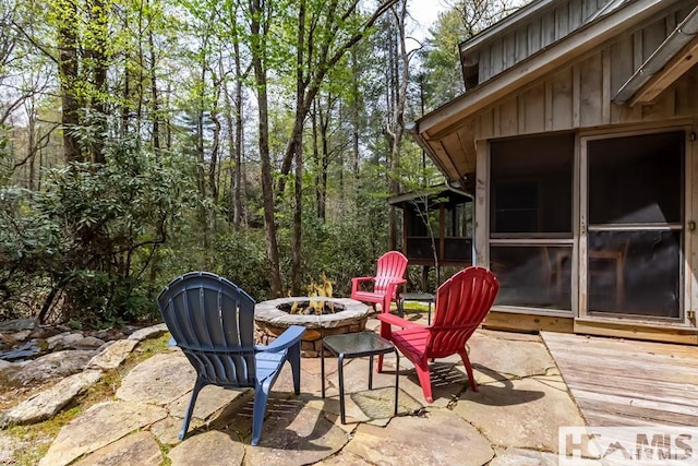 920 Sapphire Post Office Rd, Cashiers, NC 28774 - view of patio featuring an outdoor fire pit and a sunroom