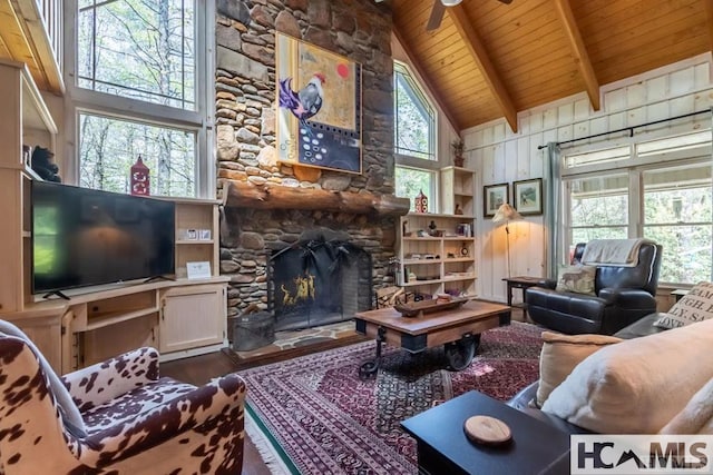 920 Sapphire Post Office Rd, Cashiers, NC 28774 - living room with a wood ceiling with exposed beams, wood finished floors, a stone fireplace, high vaulted ceiling, and ceiling fan