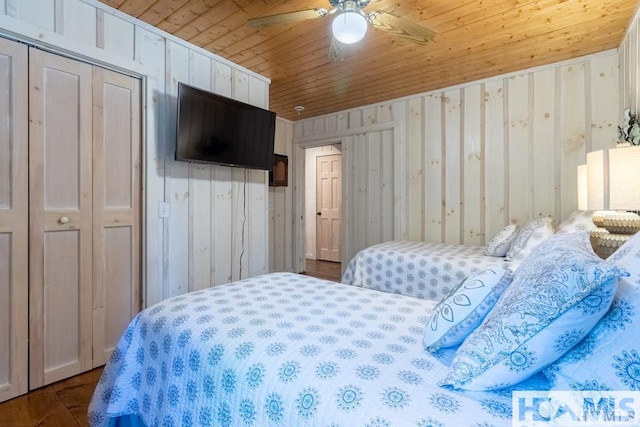 920 Sapphire Post Office Rd, Cashiers, NC 28774 - bedroom with wooden ceiling, wooden walls, and a ceiling fan