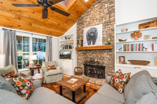 living room with a stone fireplace, built in features, lofted ceiling, ceiling fan, and wood ceiling