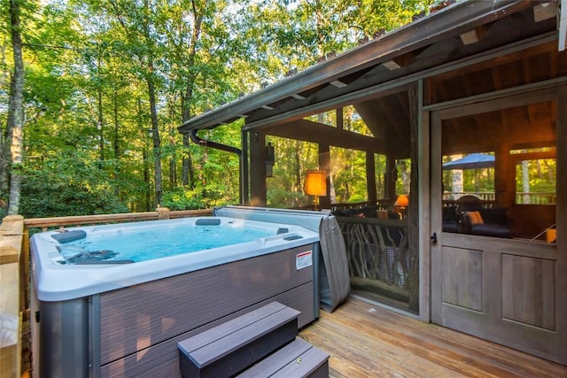 exterior space featuring a hot tub and a deck