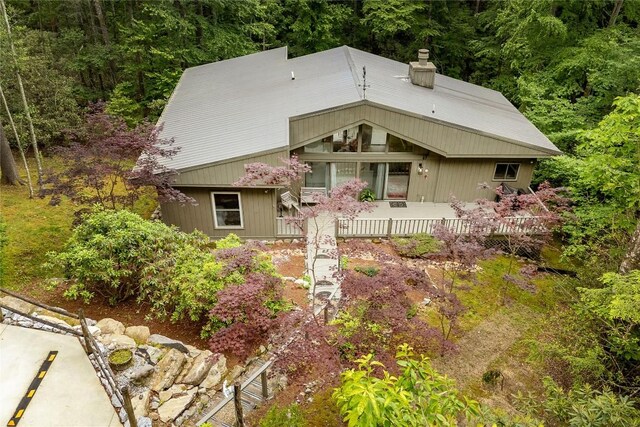 47 Red Bud Ct, Sapphire, NC 28774 - view of front of house with a chimney and a forest view